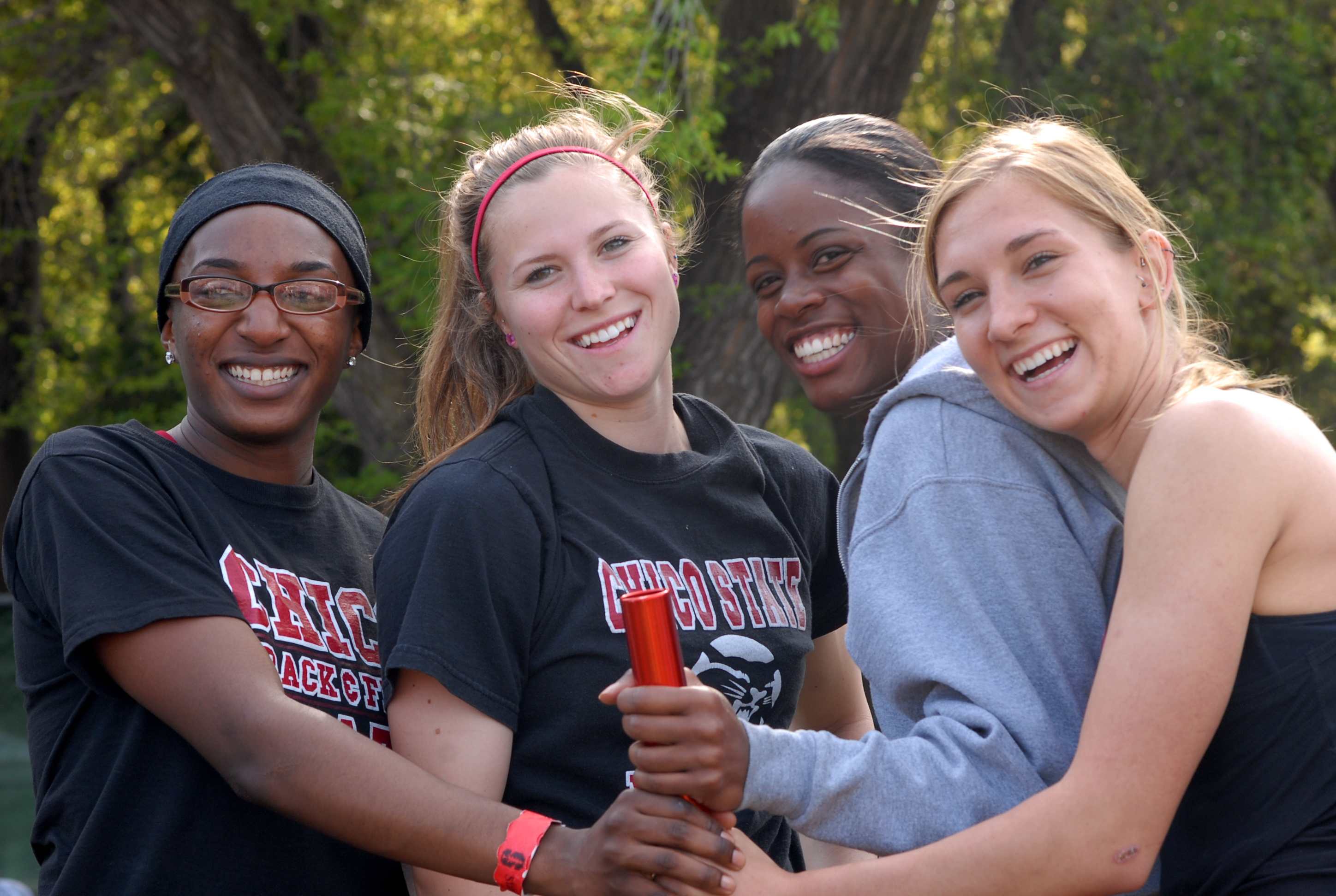 Smiles all around as Rene, Kalmar, Cooper and Rodger (l-r) reflect on setting school record in 4 X 400